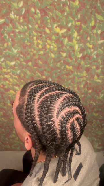 Curved cornrow pattern with precise parting